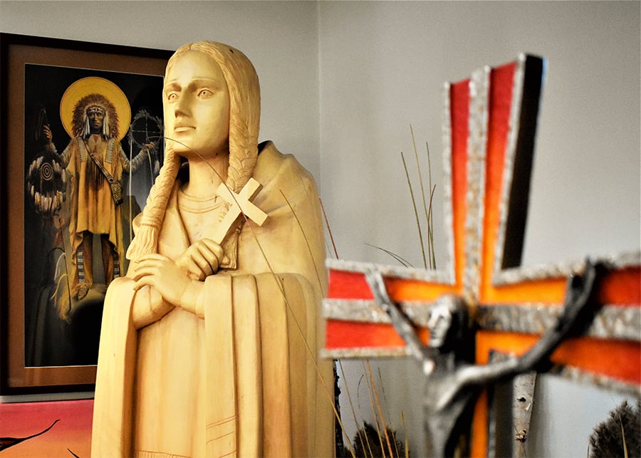 Statue of St. Kateri Tekakwitha and a crucifix